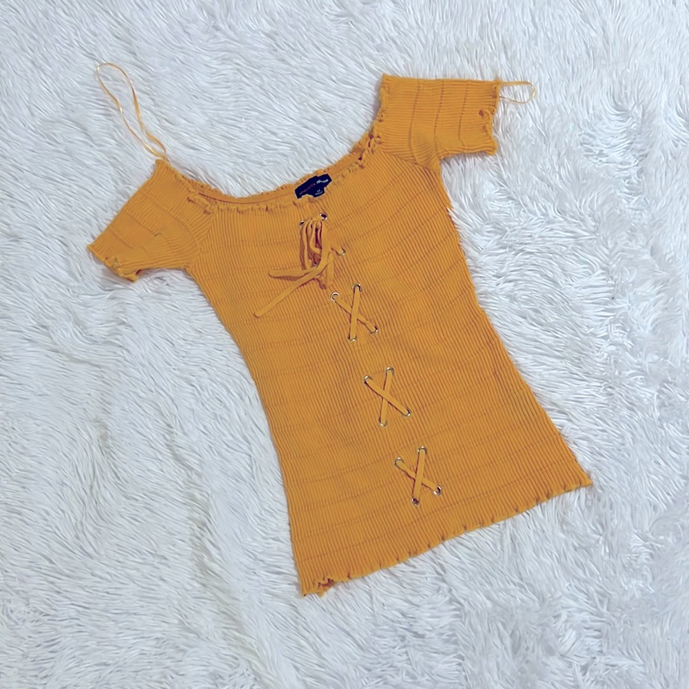 Brand new. Never worn. Yellow shirt. Size medium.